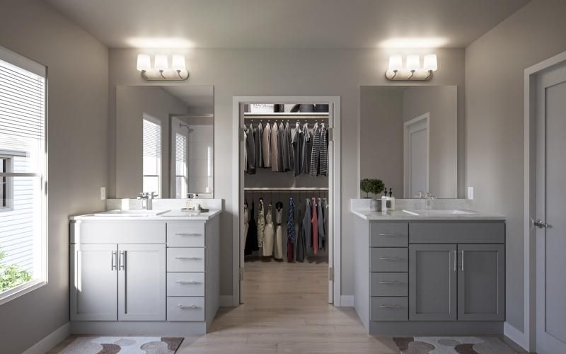 a bathroom with white cabinets