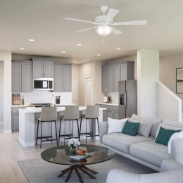 a living room with a couch and chairs