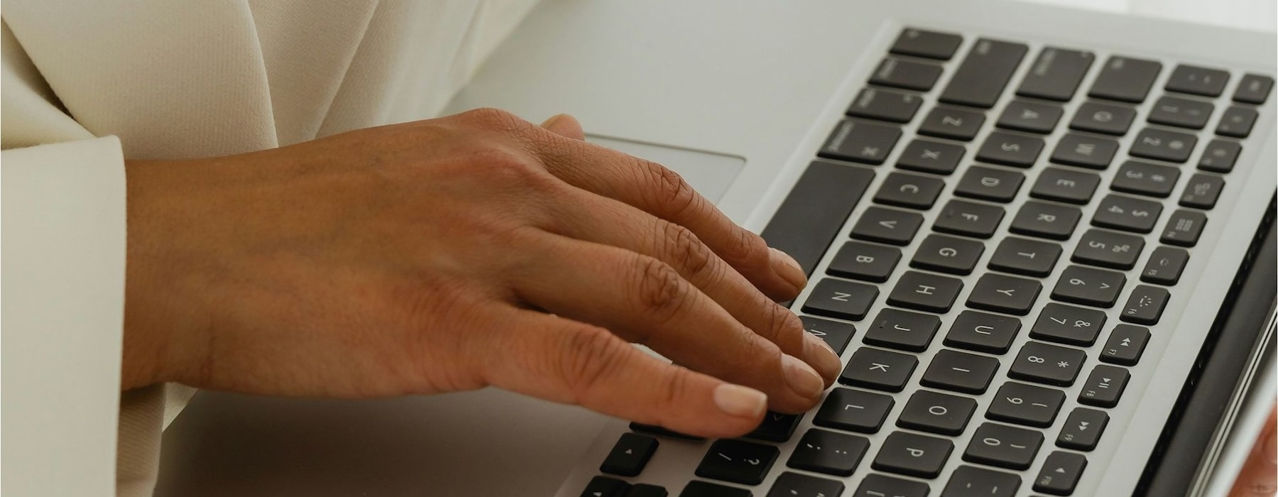 a person typing on a laptop